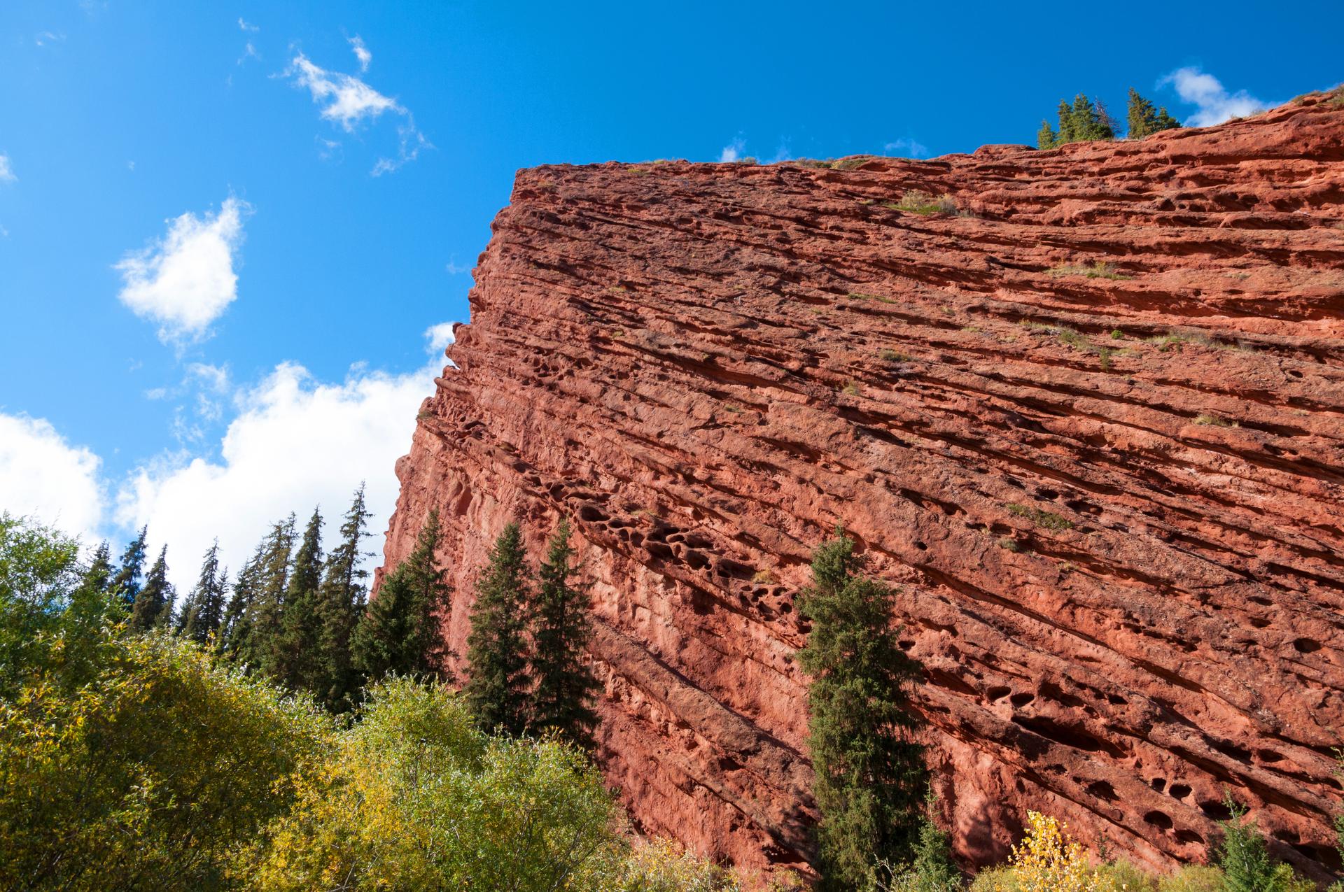 Amazing red stone formations in Jeti-Oguz Mountains (Seven bulls Rock Canyon) near Karakol, Kyrgyzstan