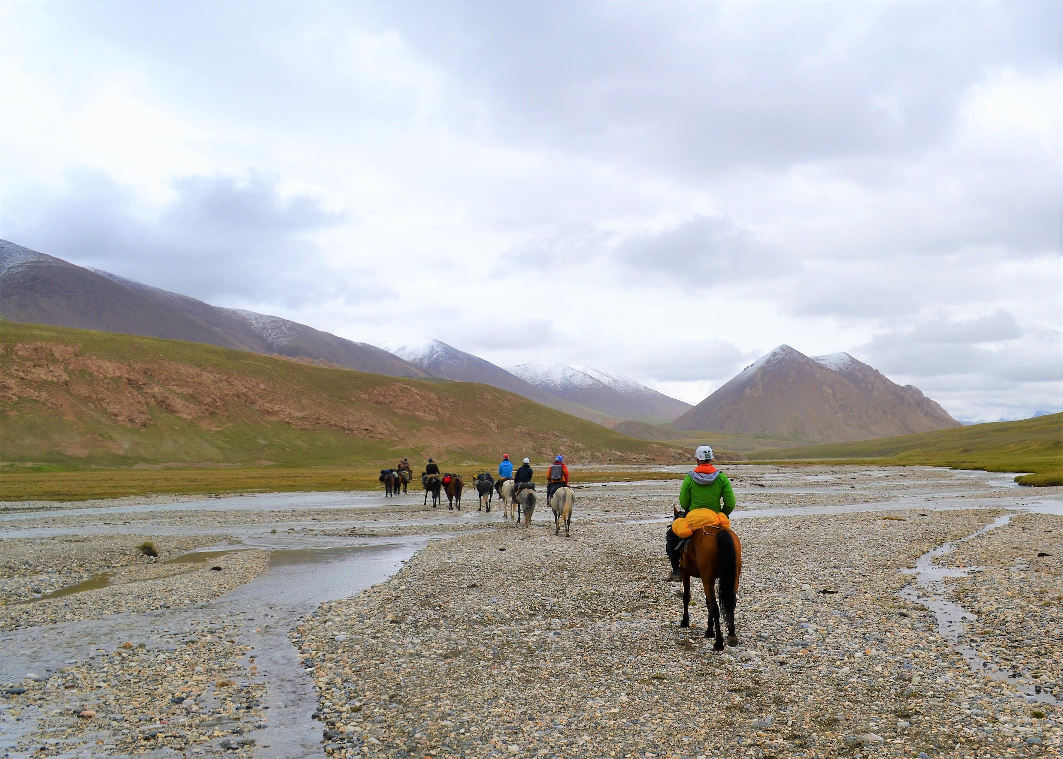 horseback riding on the foot print of the Swiss adventurer Ella Maillart, crossing a river