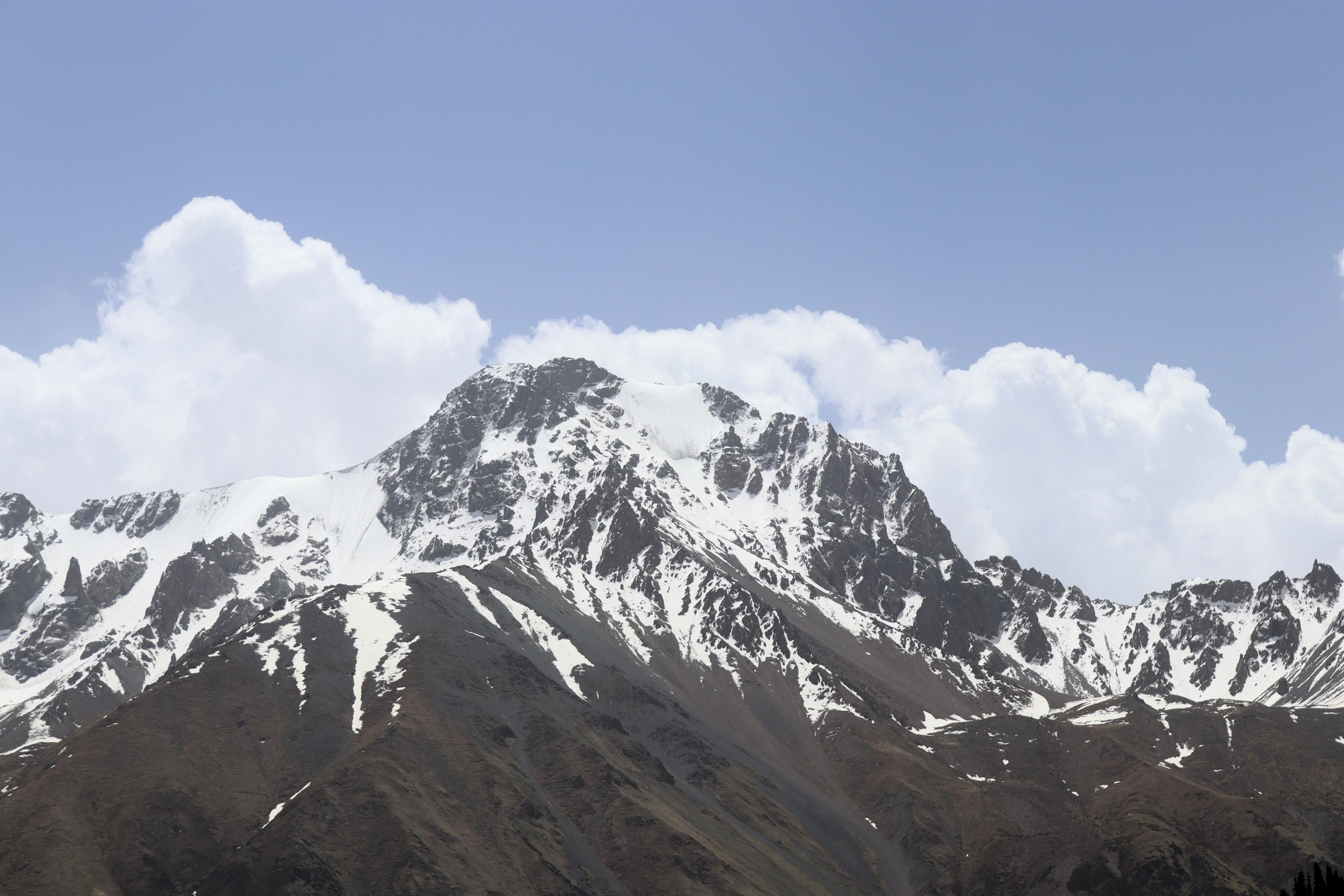 A rocky peak with a small glacier in the Barskoon valley