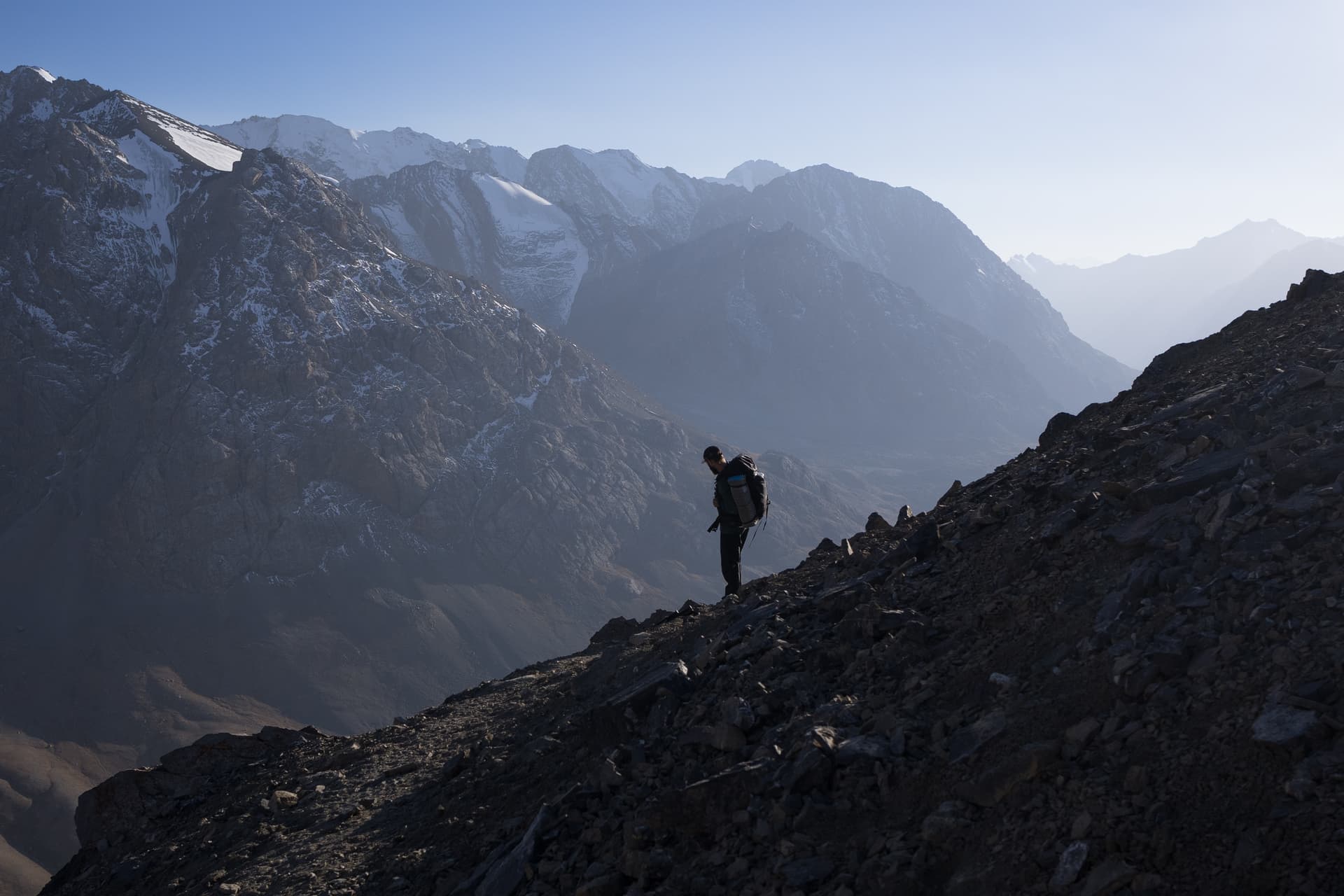 Man hiking down the Tien Shan range